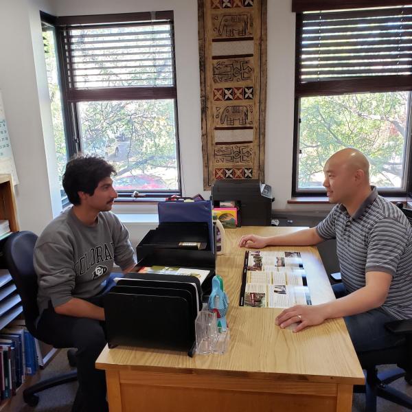 IEC advisor speaking to student
