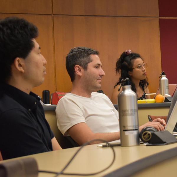 four students sitting at a table