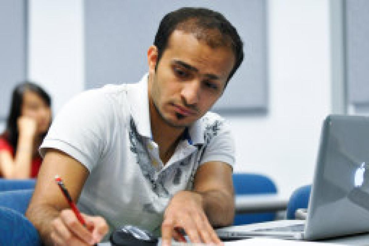 student writing in class