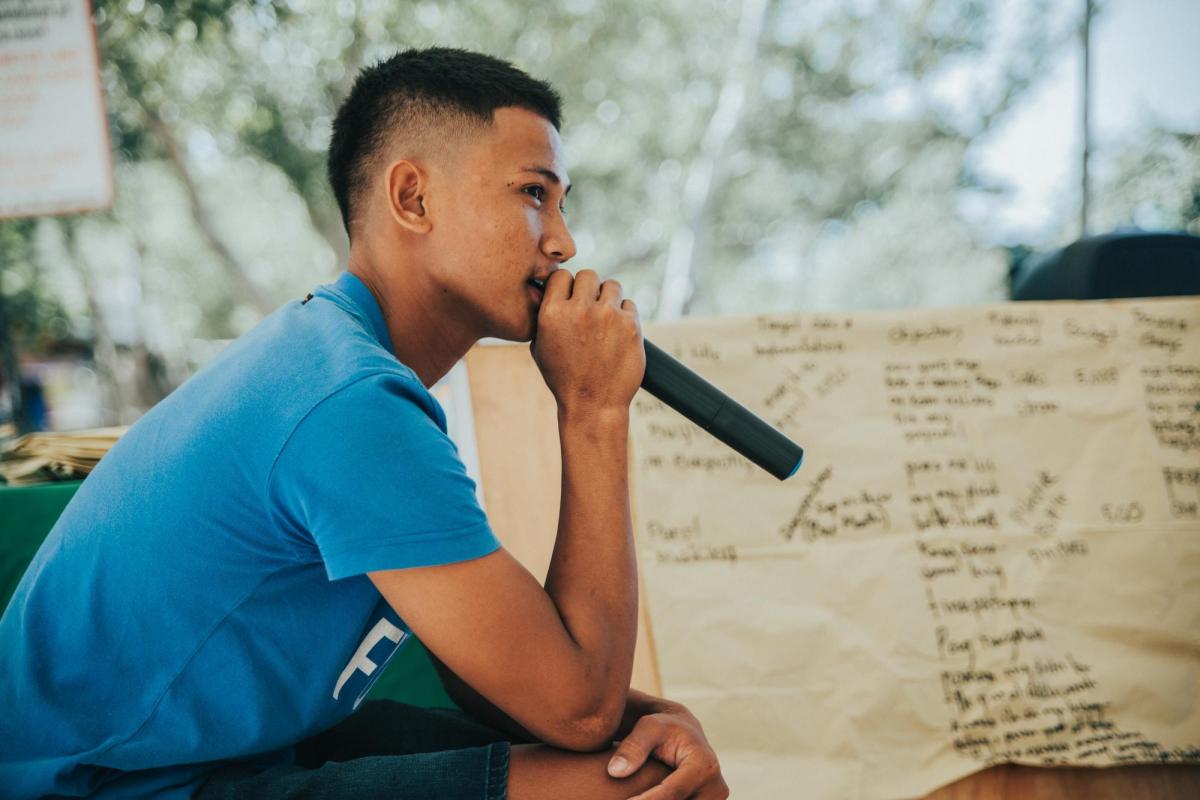 Young man holding microphone