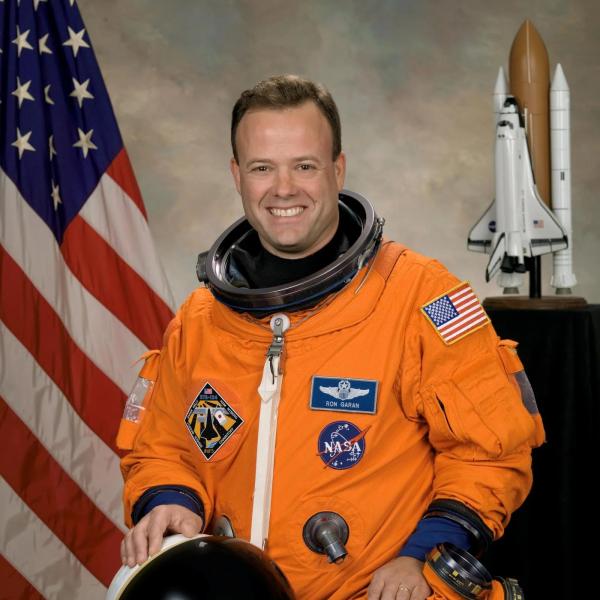 Official NASA portrait of Ron Garan wearing a spacesuit