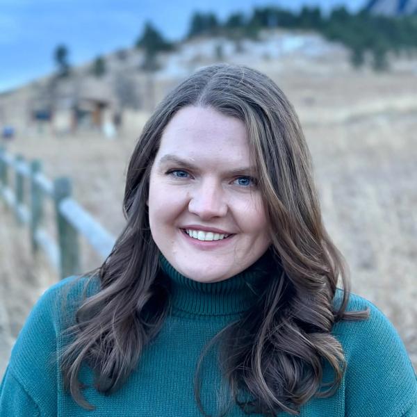 Smiling woman in green sweater