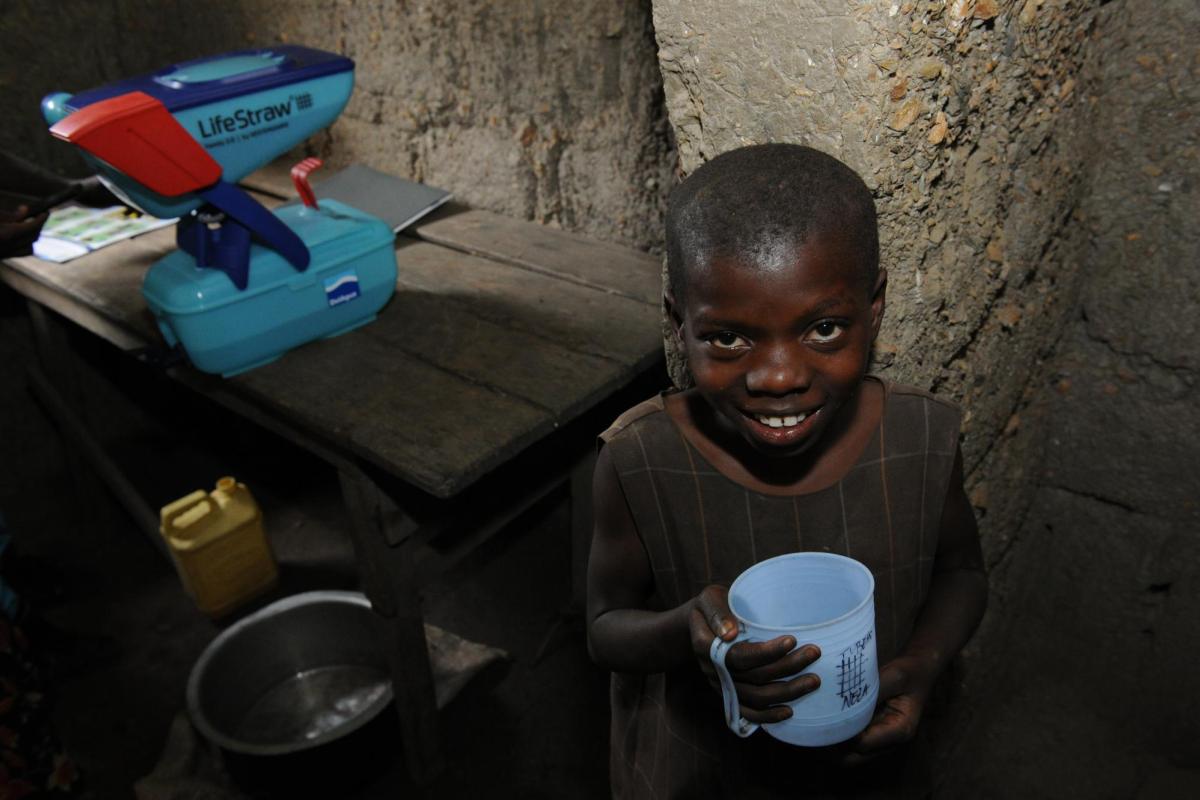 Boy drinking Life Straw water