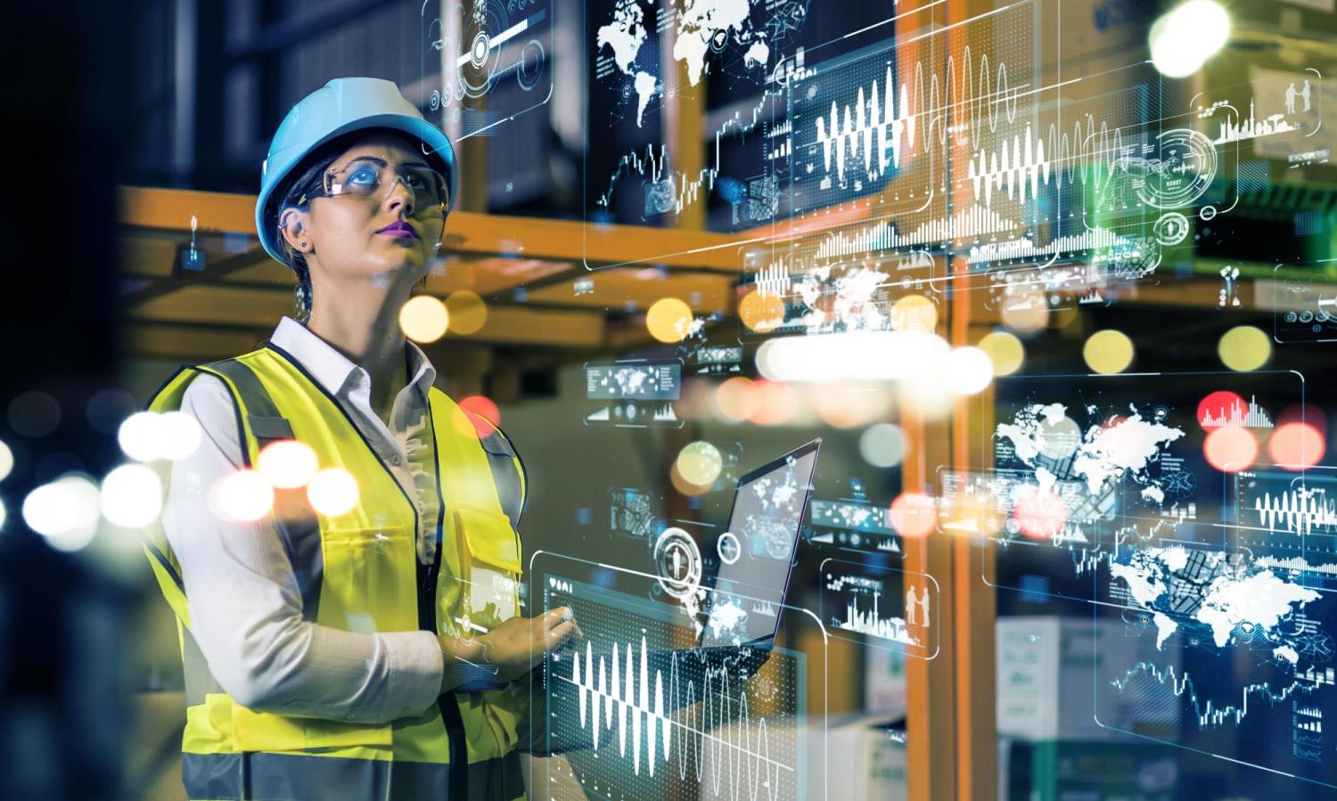 Woman wearing safety goggles and construction vest standing in a virtual engineering background