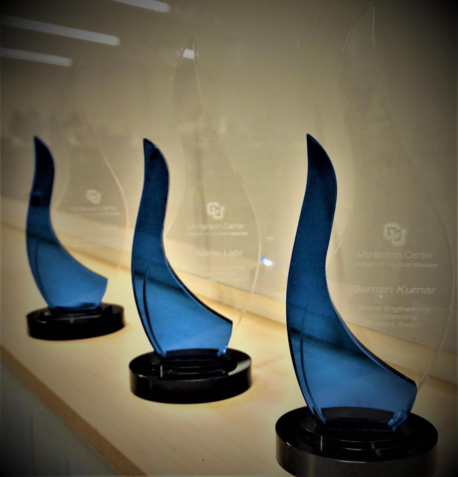 Three Awards on a Table