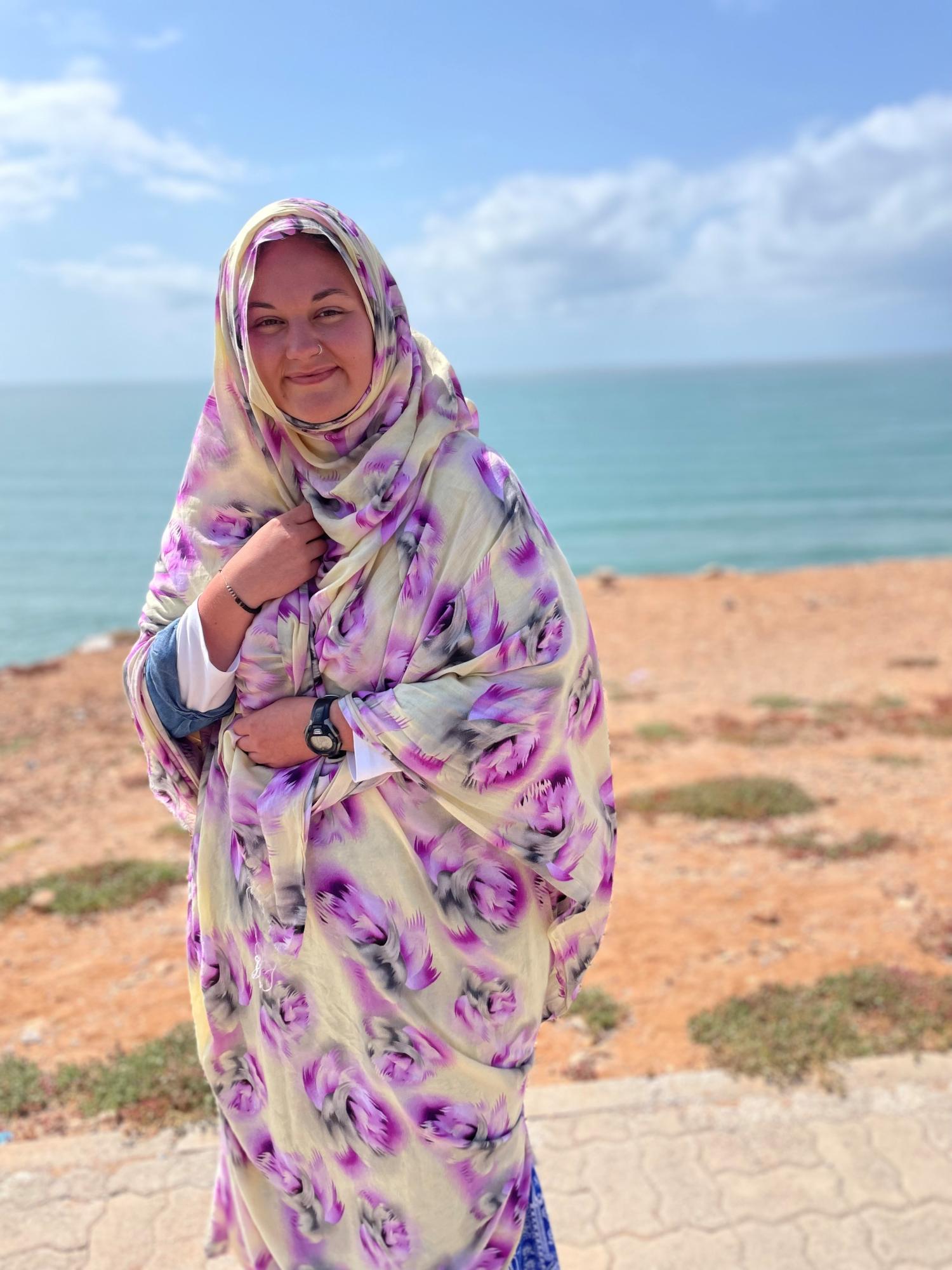 student on beach by ocean