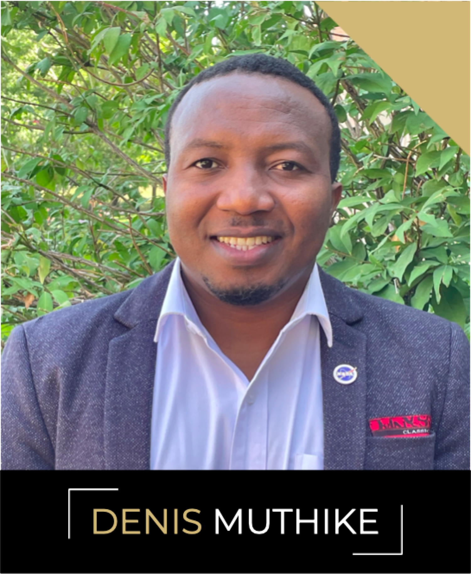 Denis Muthike, a man with a goatee in a light blue collared-shirt and a grey sport coat