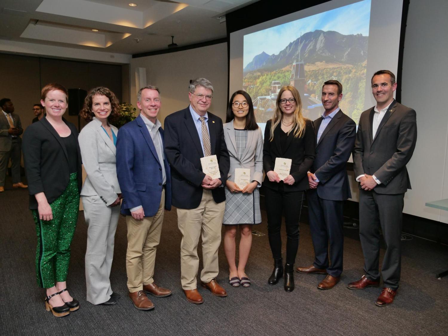 The recipients of the award along with the Dean of Engineering, the Director of the Mortenson Center and staff