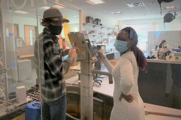 Students working on a pump in the lab