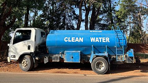 Water truck that says clean water on the outside of it