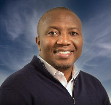 Faculty member smiling in headshot