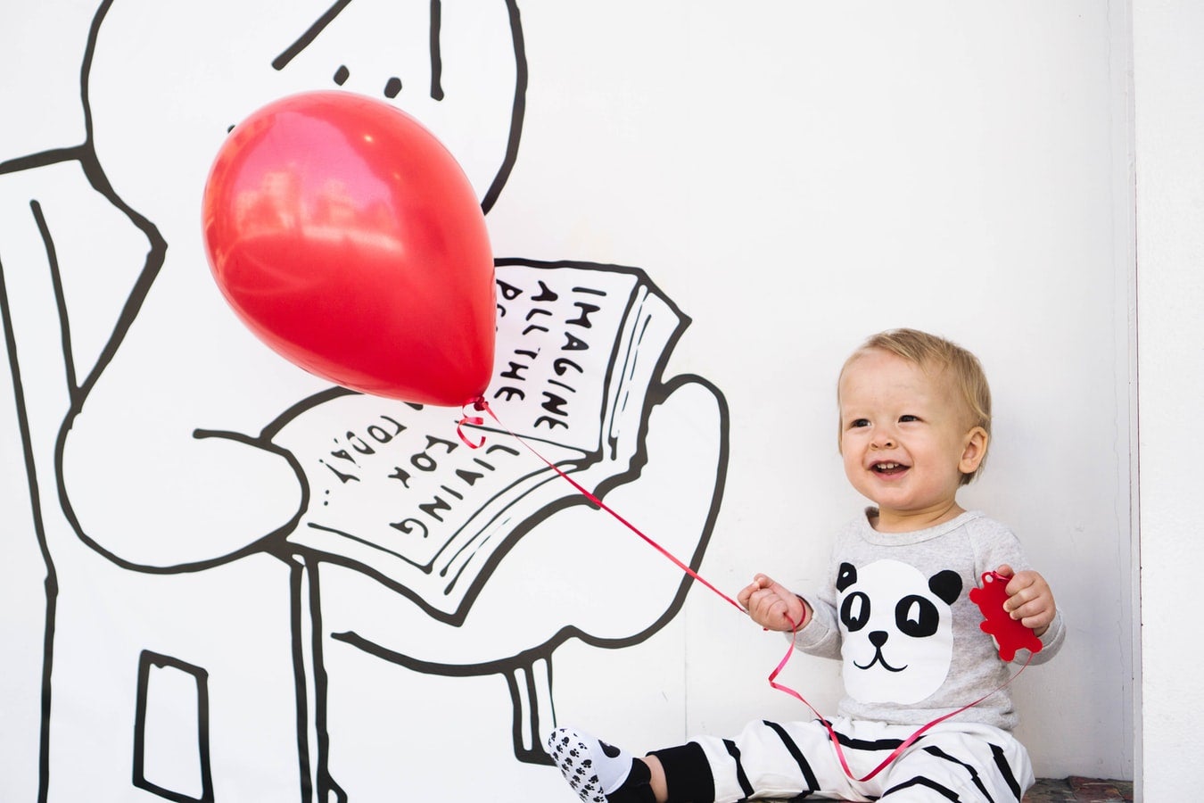 Toddler holding a balloon