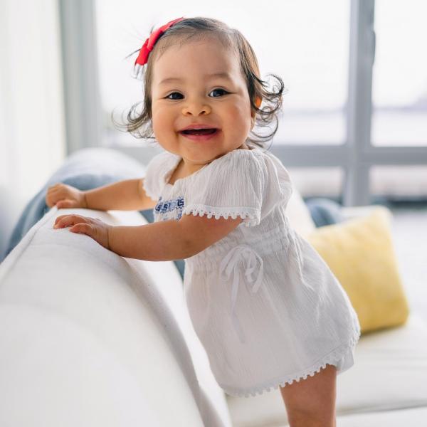 toddler standing on couch