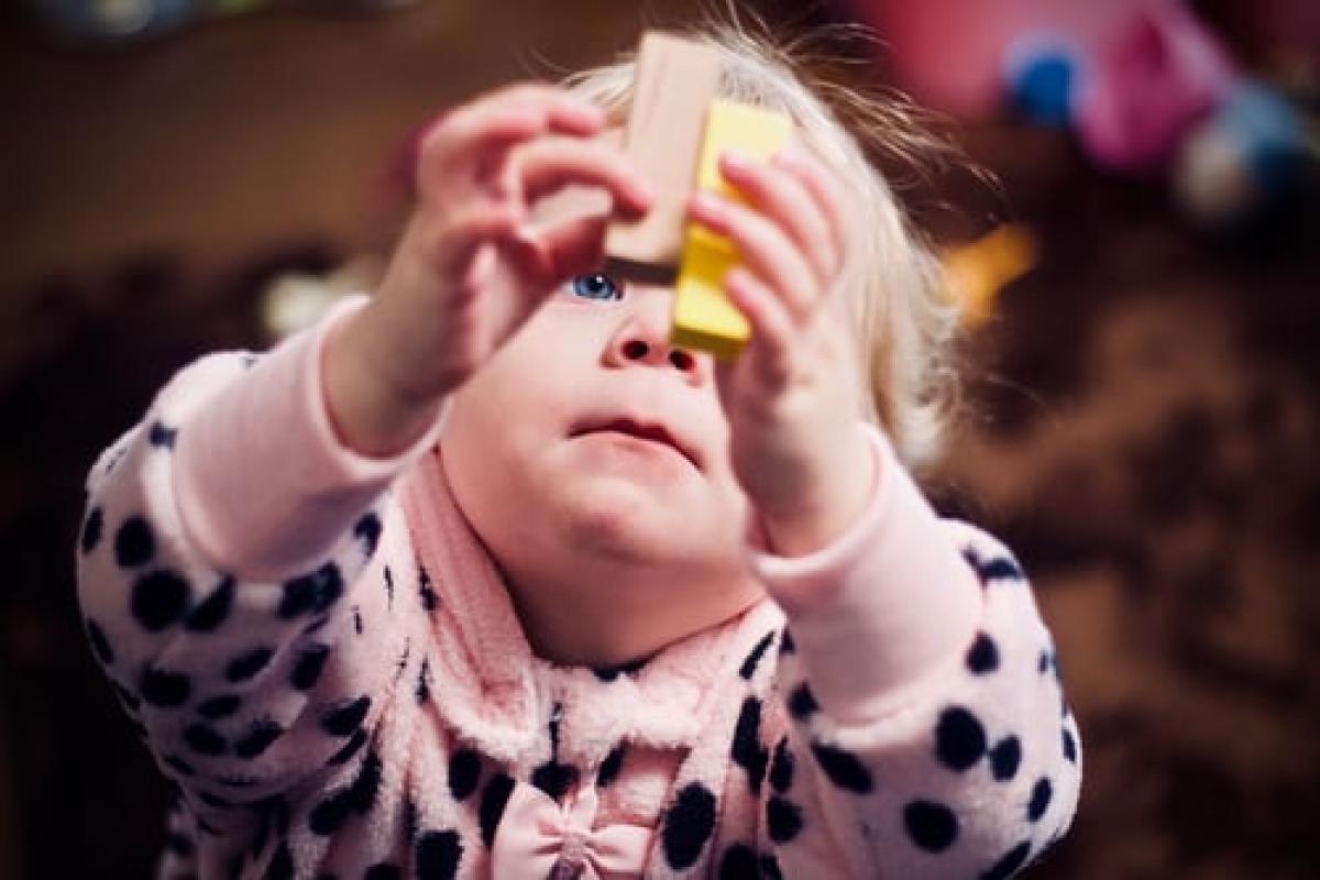 toddler looking at blocks