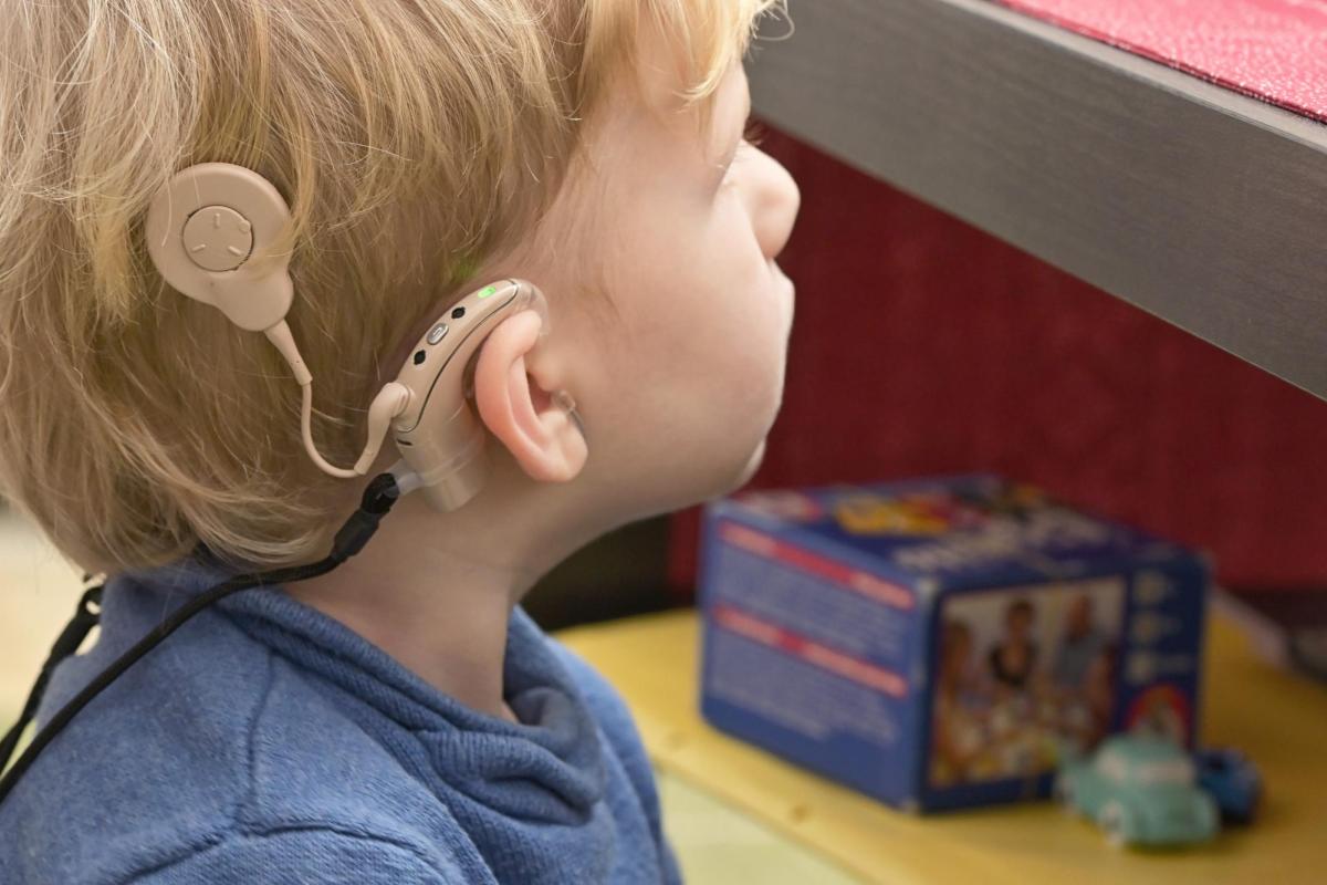 toddler with cochlear implant