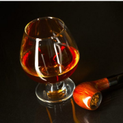 brandy glass and smoking pipe