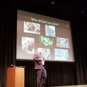 Dr. Hutchison explaining slide about "why you should care" about cannabis research