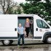 Kent Hutchison and Angela Bryan standing with mobile laboratory