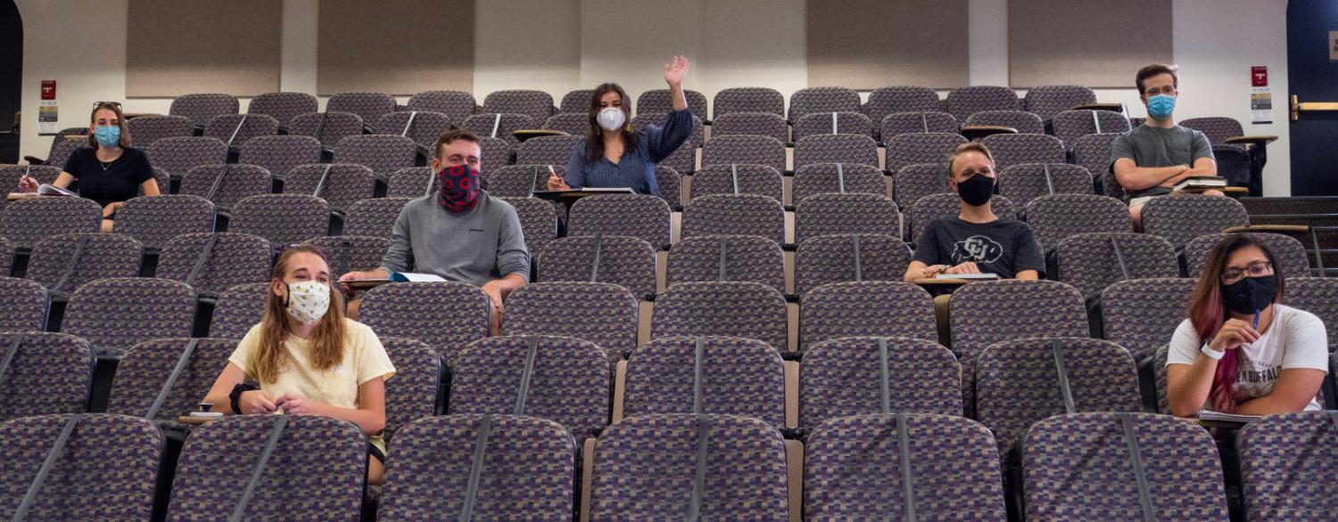 Students sit, distanced and masked, in a CU Boulder classroom