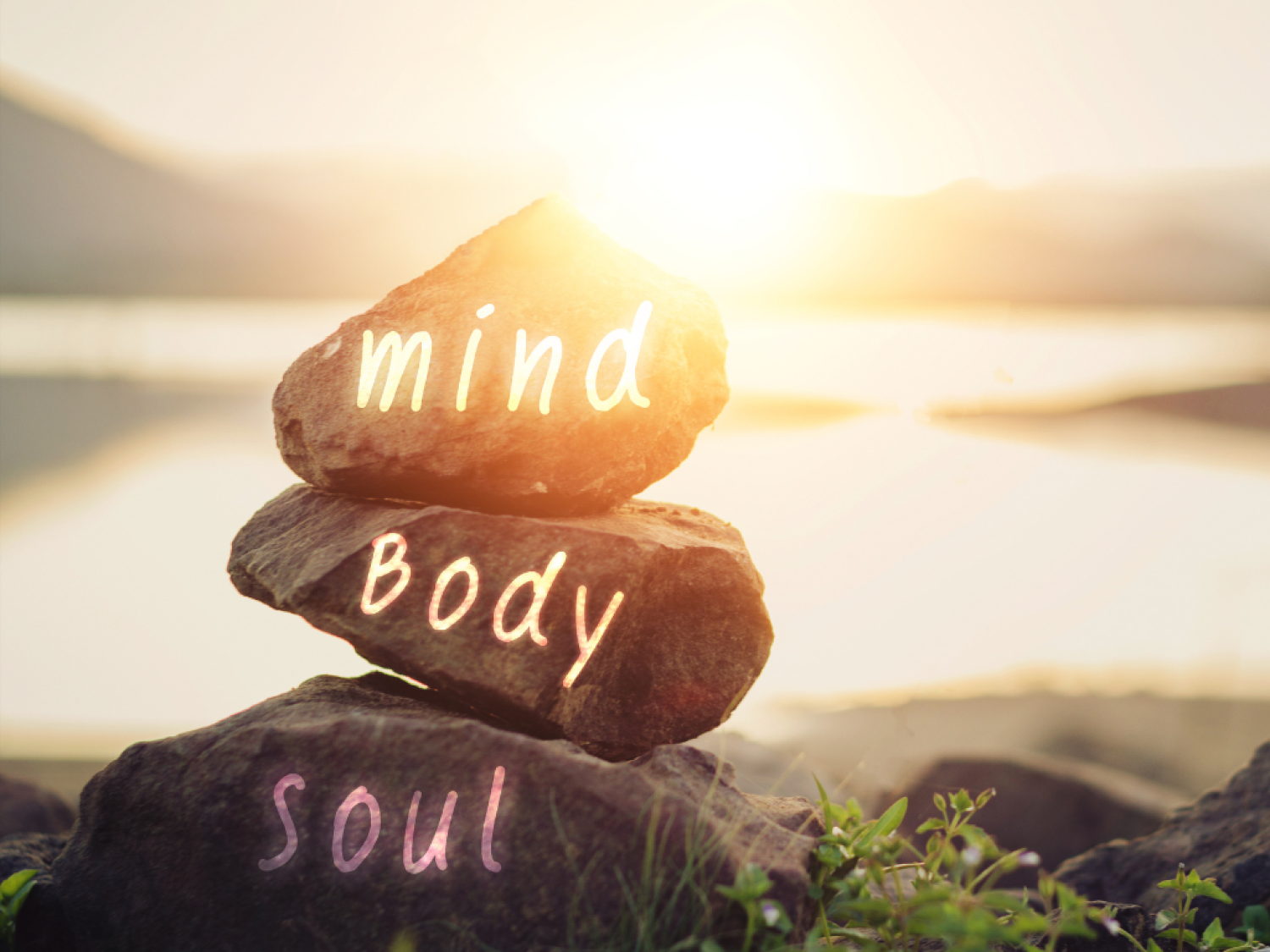  mind body soul rocks stacked on top of one another