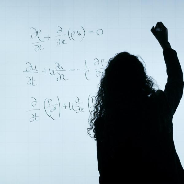 professor writing on a white board