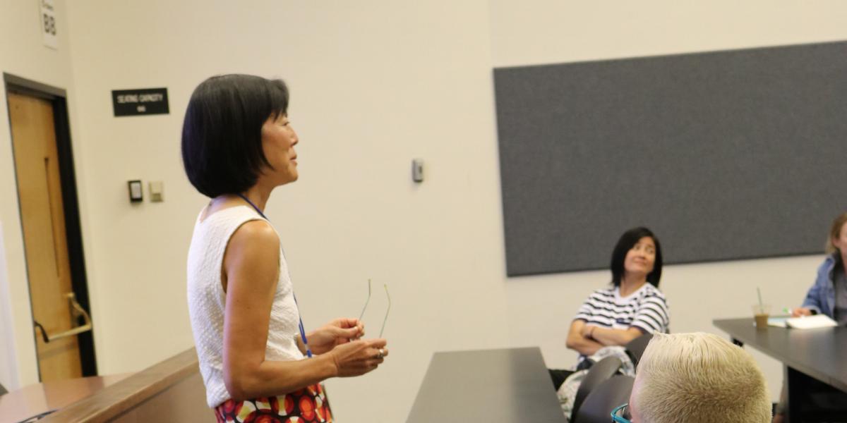 faculty member talking with class