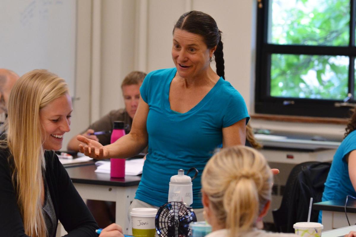 Valerie Otero teaching a group of students actively engaging in group work