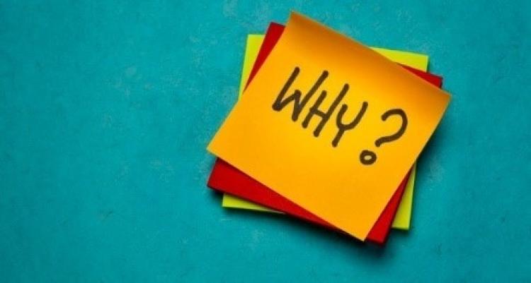 yellow sticky note with the question "why?"