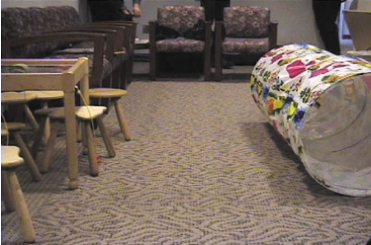 A fabric tunnel set up in a waiting room