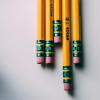 Pencils rest on a notebook