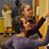 Two students work a chemistry problem at a blackboard
