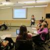 A CU Boulder professor stands at the front of a classroom