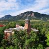 The Old Main building sits in front of the Flatirons