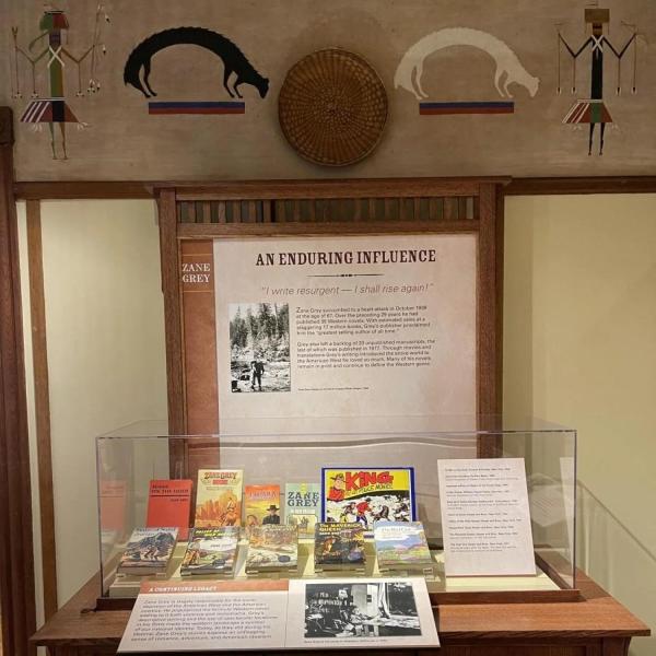 Interpretive display showcasing Zane Grey's novels and legacy