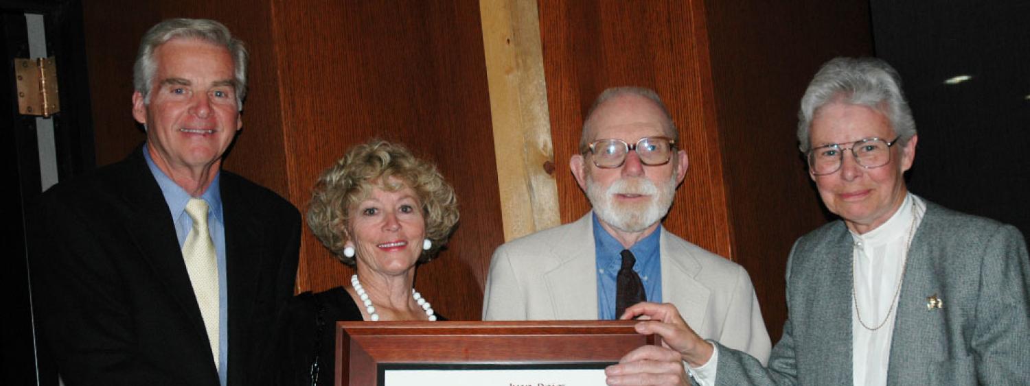 Ivan Doig receiving Stegner Award with Alan and Carol Ann Olsen