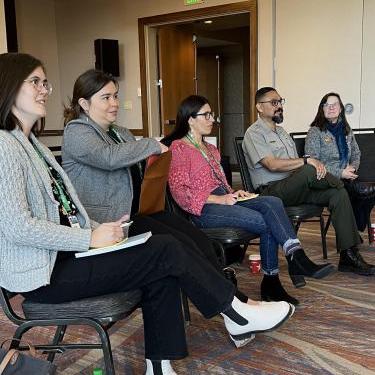Panel discussion at the 2023 American Association of Geographers, April 2023. (From left to right: Brooke Neely, Natasha Myhal, Ashlyn Barnett, Rising Buffalo Maybee, and Kim Swift)
