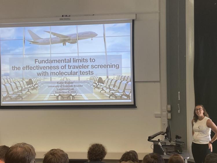 Kate Bubar presenting in a lecture hall at the Infectious Disease Dynamics conference