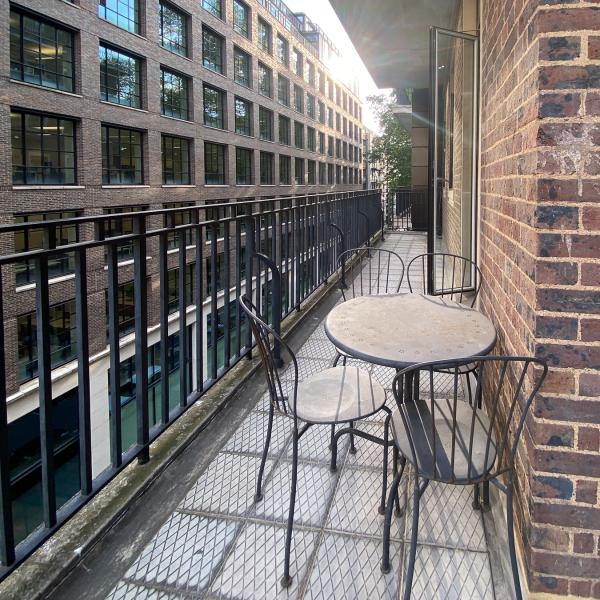 Balcony with patio table and chairs