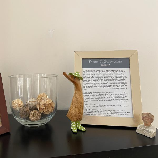 Picture frames on top of bookcase