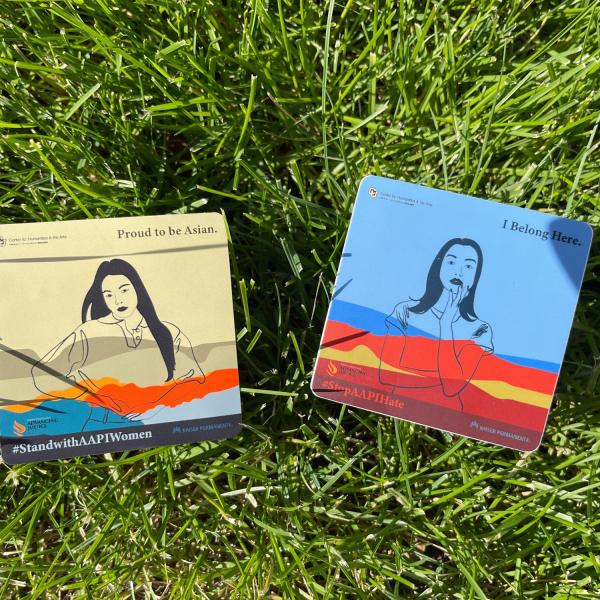 "Where I'm Planted" 2 stickers in grass. Sticker on left has a yellow background with East Asian woman with phrase, "I'm proud to be Asian".