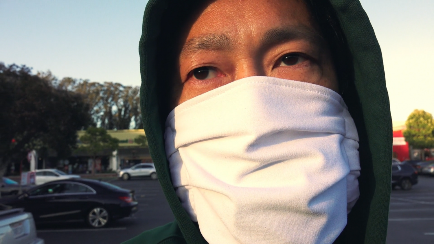 Kevin B. Lee headshot in a mask