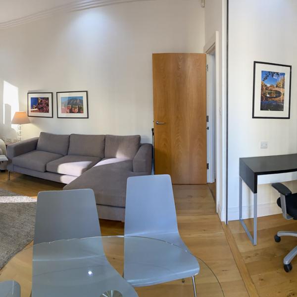 Panoramic view of living room and office space