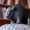 Buffalo toy in front of books