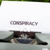 Conspiracy typed on paper on a type writer