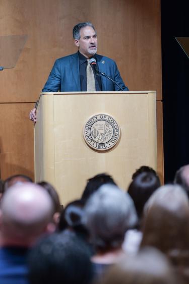 Justin Schwartz speaks at podium