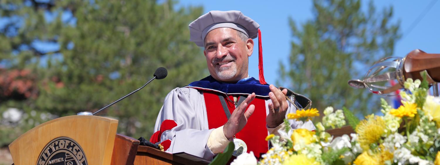 Chancellor Justin Schwartz on stage at Commencement