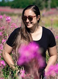 Mia Keyser in a field of flowers