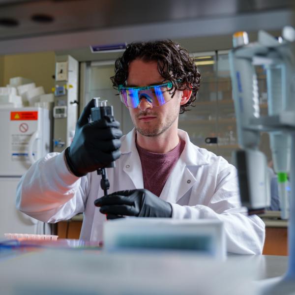 Cooper Thome, a doctoral candidate in the Department of Chemical and Biological Engineering, uses a new "acoustic pipette," which could someday be used to deliver swift test results at the bedside with only a finger-prick of blood.