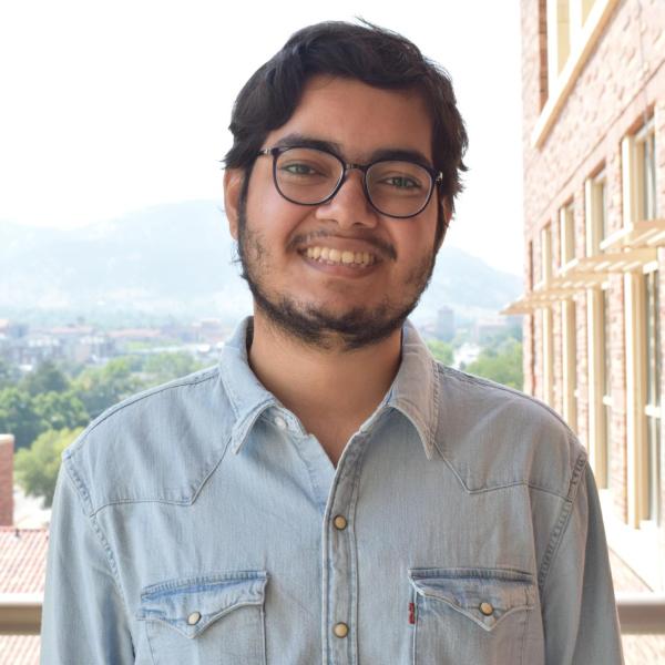 Arkava Ganguly on balcony on CU Boulder campus.