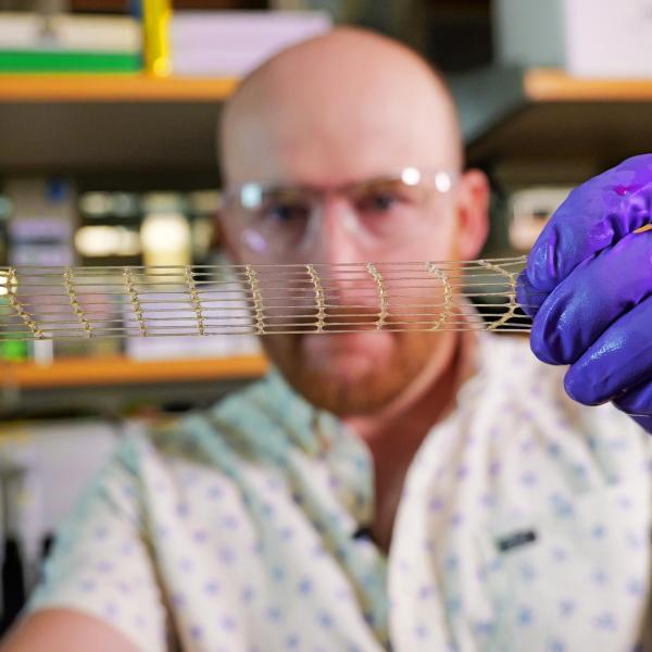 Matt Davidson, a research associate in the Burdick Lab, shows off a 3D-printed material that could be used for a variety of medical applications.